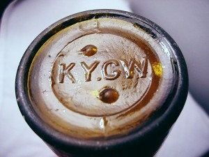 Amber beer bottle with KY.G.W. mark on bottom, made by Kentucky Glass Works Company of Louisville.