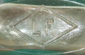 LF in a diamond - on base of tooled-lip "Strapside" flask. (Picture courtesy of Jimmy Bray)