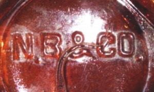 N B &amp; CO amber bottle base shard (Photo courtesy of Jon McCormack)