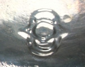 Diamond/oval/I mark used by Owens-Illinois Glass Company bottle, as seen on clear bottle base shard. Diamond/oval/I mark used by Owens-Illinois Glass Company bottle, as seen on clear bottle base shard.