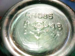 Diamond/Oval/I trademark on bottom of green soda bottle made in 1948. The "3" plant code to the left of the logo indicates manufacture at Fairmont, West Virginia.