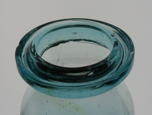 Wax sealer groove ring lip - wax would have been poured into the groove with a metal lid put in place to seal the jar.