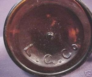 Lyndeborough Glass Company , South Lyndeboro, New Hampshire - base of amber "cylinder whiskey" bottle, pic by unidentified ebay seller