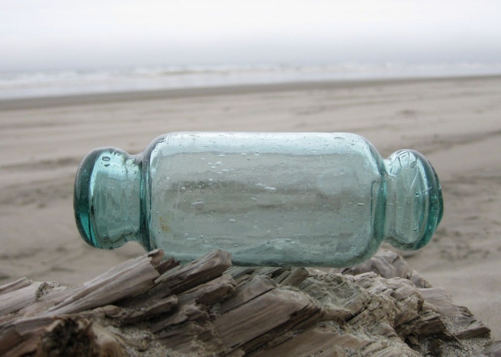 Japanese "Roller" or "Rolling Pin" style glass fishing float in aqua colored glass. Photo courtesy of Kamichia Rudnick.