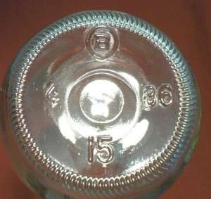 Brockway Glass Company - base of 1986 clear soda bottle. The "4" plant code indicates manufacture at Lapel, Indiana (former Sterling Glass Company plant) and "15" is the mold number.