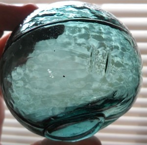 Aqua Glass Fishing Float, marked with 2 slash marks: I I . Made in Korea or Japan; this float measures 3 inches in diameter.