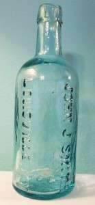 Southern Glass Company- John J Smith bottle - S.G.CO. on base