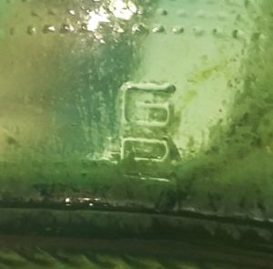 GC mark on heel of green "stubby" type beer bottle.