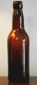 Dark amber "R & CO" export beer bottle (mold number 49 on the base) made by Reed & Company of Massillon, Ohio.