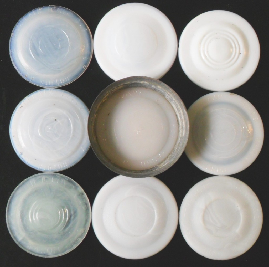 Group of Milk glass "Boyd" type milk glass antique fruit jar liners with various markings.