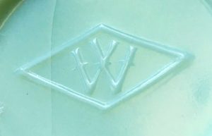 Glass manufacturers Marks: "W in a diamond" used by Westite Glass Company, as it appears on the base of a jade green milkglass vase (photo courtesy of Abby Chovanec)