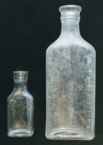 Antique Glass Bottles, Vintage Bottle Collecting, information. Two clear antique glass medicine bottles marked "LYRIC" on their bases, made by Illinois Glass Company