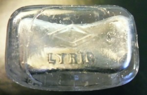 Base of smaller "LYRIC" bottle, made by Illinois Glass Company of Alton, Illinois.