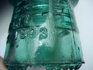 Hemingray NO 9 glass insulator, with embossed "3" with a tail mold