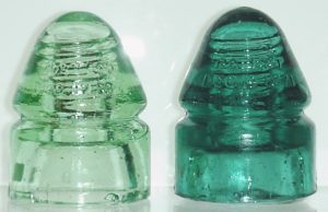 Two early glass telegraph insulators made by Hemingray Glass Company at Covington, KY. They date from the 1870s or 1880s, and are marked "PATENT DEC 19 1871". 