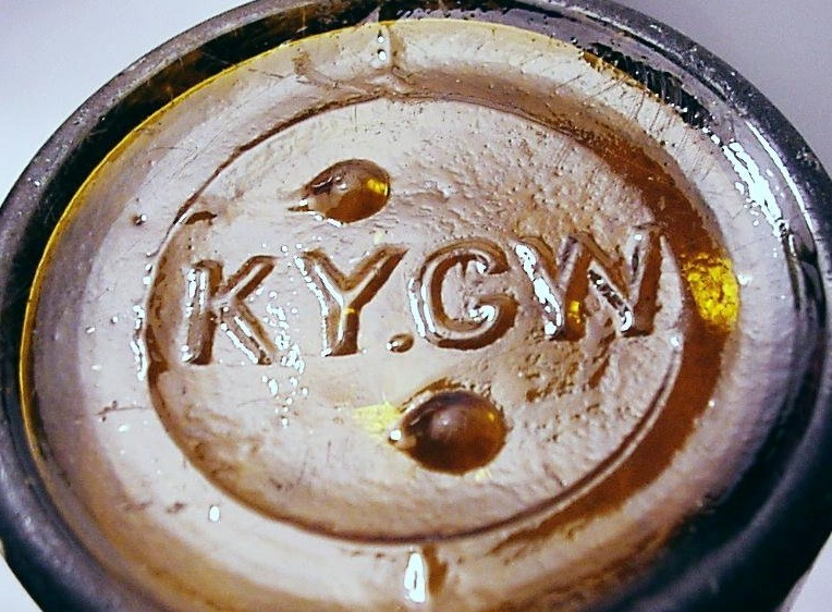 KY.G.W. mark on base of amber beer bottle made by Kentucky Glass Works Company.