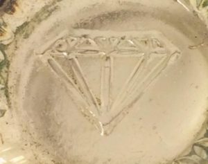 Cut diamond or some other type of jewel mark. on shot glass. (Photo courtesy of Patti Moreno.)