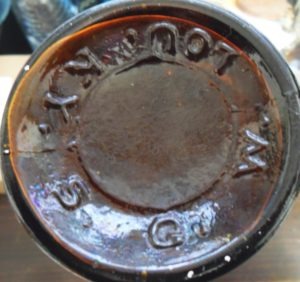 Glass Manufacturers Marks: S.G.W. LOU. KY. mark on base of amber cylinder whiskey - Southern Glass Works, Louisville, KY