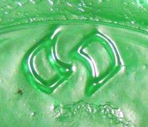 American National Can Company logo, on base of 1990 green soda bottle