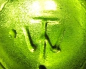 TW Monogram on base of dark green bottle