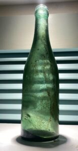 Another type of bottle bearing this mark - Crown-style lip soda or mineral water bottle in a medium teal aqua or teal green, probably made in Great Britain.  (Photos courtesy of Rich Gurry).