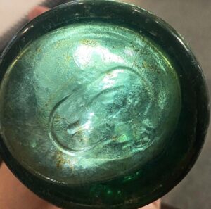 Base mark on crown-style lip soda bottle, found by Rich Gurry.