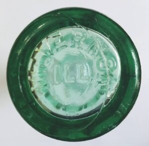 Base of aqua (Coke bottle green) Coke bottle made by Owens-Illinois, marked MT VERNON ILL on bottom. Possible date code of 1947 on side.