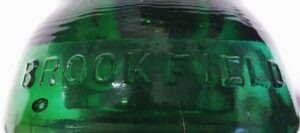 BROOKFIELD embossed name on emerald green glass telegraph insulator - CD 152 type.