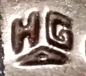 HG over triangle mark on bottom of flask shard- made by Hillsboro Glass Company