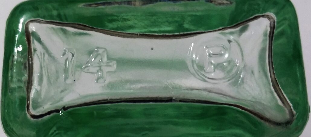 Base of Chas. H. Fletcher's Castoria bottle, bearing the "P in a circle" trademark for Pierce Glass Company.