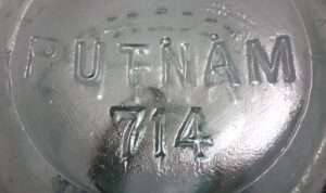 PUTNAM 714" marking on the base of a Trademark Lightning type light aqua glass fruit jar.