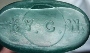 Base of standard "Ginger Oval" or medicine bottle made by Kentucky Glass Works Company