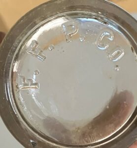 F F P Co on base of glass tumbler or bottle shard - Unknown origin - Photo courtesy of Miles Burke