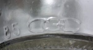 CGC mark on heel of clear glass soda bottle- Container General Corporation 1983-1985