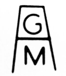 Letters G and M inside rectangular "A" logo, used on bottles manufactured by Australian Glass Manufacturers Company.