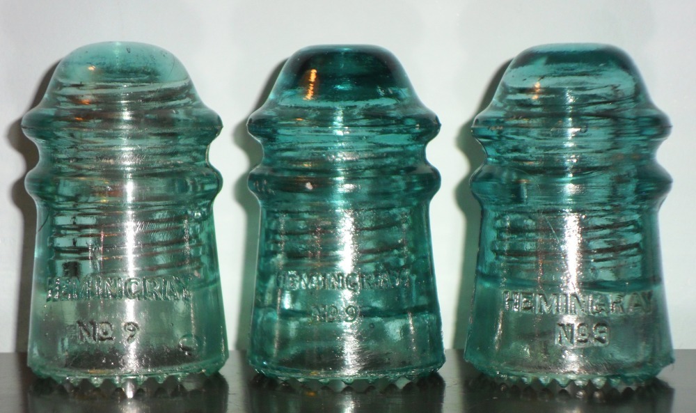 HEMINGRAY No. 9 insulators: Left to right: Evo 1 ; Prismic (Loop 2); Prismic (Swan 2) -- (Front skirt embossing)