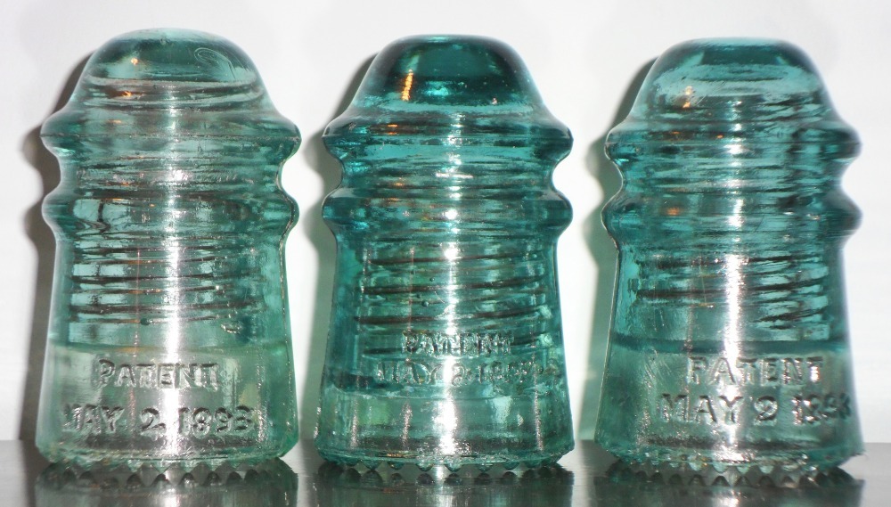 Hemingray No. 9 embossed lettering on insulators: Left to right: Evo 1; Prism "loop" 2; Prism "Swan 2" (rear skirt)