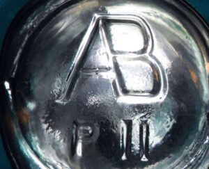 AB (connected) mark on base of beer bottle - with P 11 code