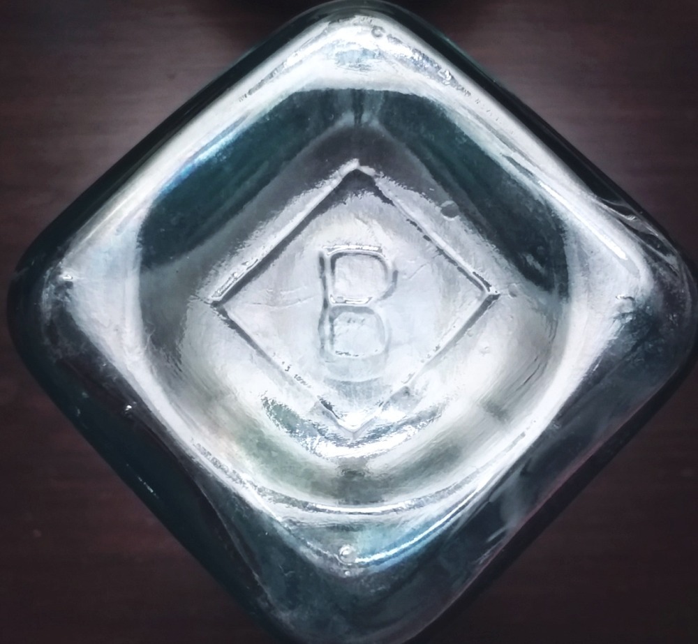 B inside a diamond ~ mark on the base of a blue-aqua horseradish or pickle bottle made by Binghamton Glass Company