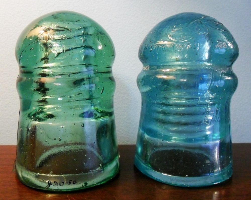 Two CD 126 style Brookfield insulators, in light green and light blue aqua, dating from the 1880s.