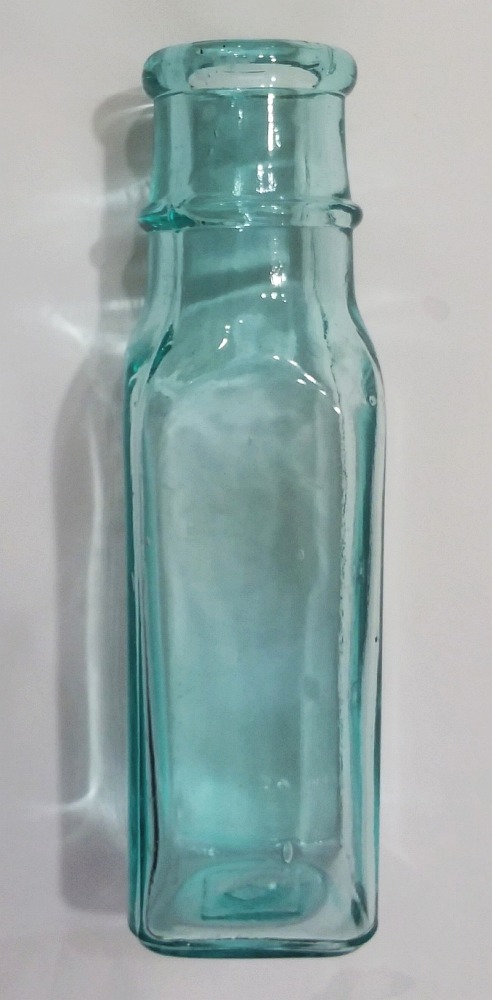 Horseradish or Pickle bottle in aqua, with "B in a diamond" mark on the base, made by Binghamton Glass Company.