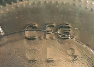 "C.F.G." initials, as marked on the base of a green glass florist vase, standing for "Continental Floral Greens". (Photo courtesy Shannon & Dawn Brown)