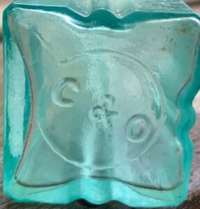 C & O on base of aqua Victorian-era pepper sauce bottle.