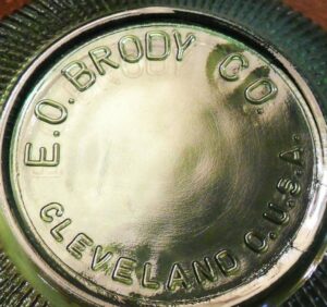 E O Brody Co- Cleveland - O- U.S.A. mark on the bottom of a green glass florist bowl.