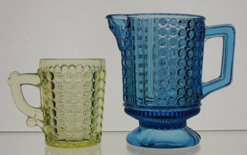 EAPG: Vaseline Glass "Sensation" or "Thousand Eye" pattern mug (Adams & Company, Pittsburgh) and a blue "Three Panel" (original pattern name: NO. 25) cream pitcher (Richards & Hartley also of Pittsburgh, PA). These were typical examples of EAPG of the 1880s period. 