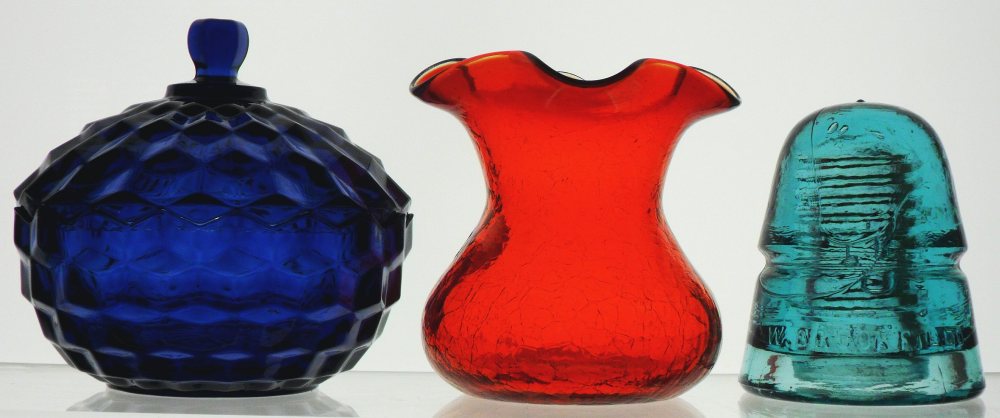 Cobalt Blue candy dish (Indiana Glass Company); Red "Crackle glass" vase (Rainbow Glass Company); Aqua Telegraph line Insulator (Brookfield Glass Company)