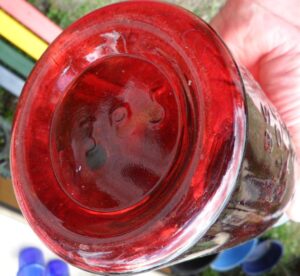 Base of repro NOV 30TH 1858 jar in ruby red glass - H395 mold number.