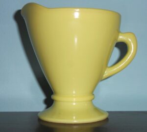 OVIDE creamer in lemon yellow Platonite, circa 1940s-1950s. Some sources call this color "Chartreuse". 