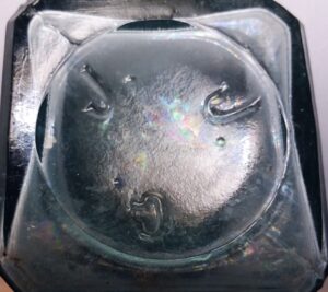 "J. J. G." on base of aqua pickle bottle. Unknown glassmaker or distributor.