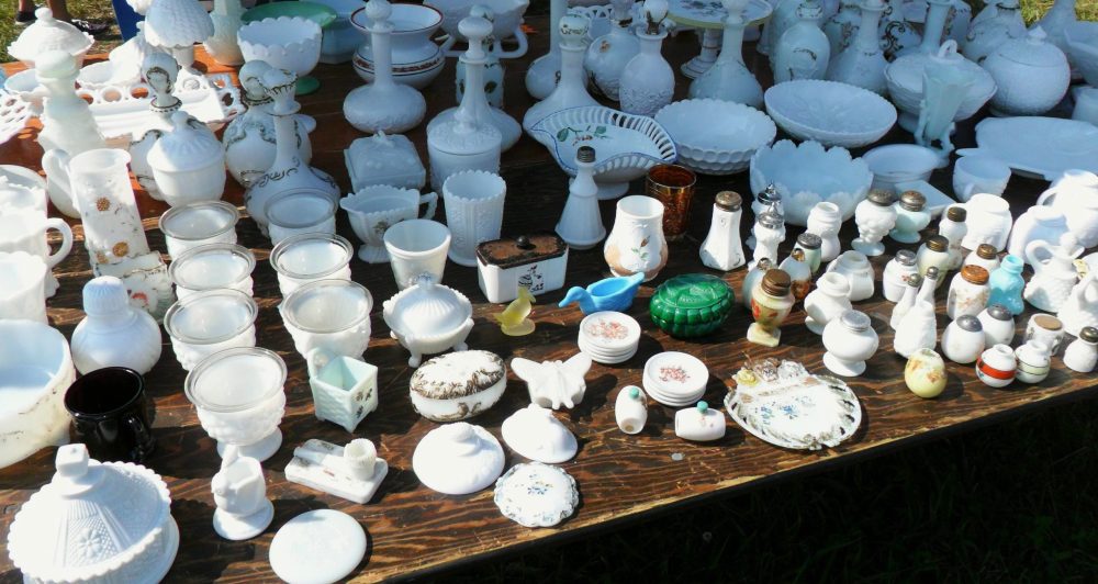 Selection of assorted collectible Milk Glass, much of it Victorian era, at outdoor flea market near Harrodsburg, Kentucky in 2018.